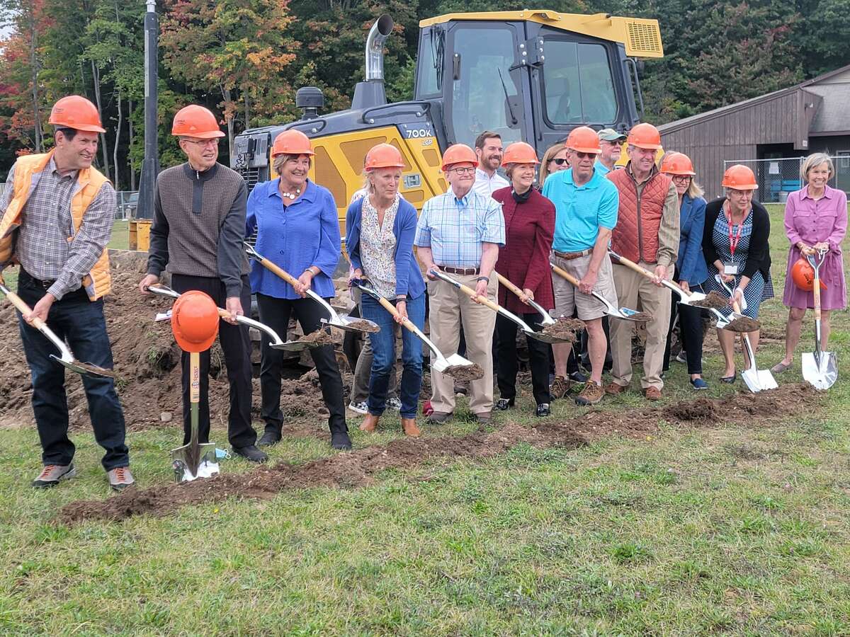 Past and current board members with the Benzie Area Christian Neighbors break ground for the new building that will house the food pantry and client services.  