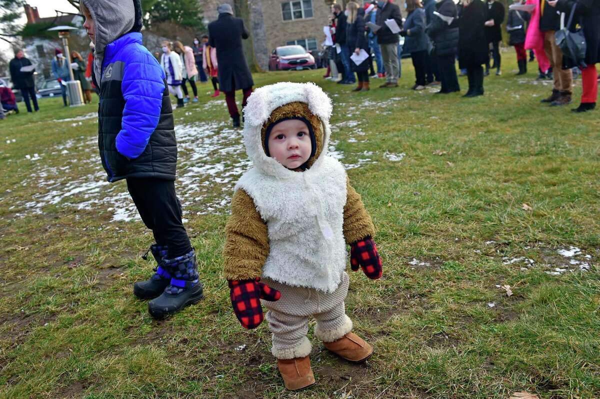 Ronan Hawes, 1, wears a sheep costume during Second Congregational Church's Outdoor Christmas Pageant and Petting Zoo in Greenwich, Conn., on Friday December 24, 2021. "The hope and joy of Christmas lift our spirits in any year," says Senior Minister Maxwell Grant. "We wanted to make sure we offered a safe way for friends to gather, and for kids to keep teaching us the story."
