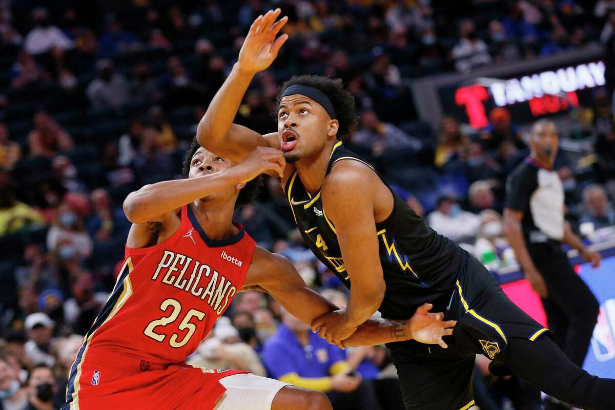 New Orleans Pelicans guard Trey Murphy III (25) and Golden State Warriors Moses Moody (4) fight for position during a free throw in the fourth quarter of an NBA game at Chase Center, Friday, Nov. 5, 2021, in San Francisco, Calif. The Warriors won 126-85.