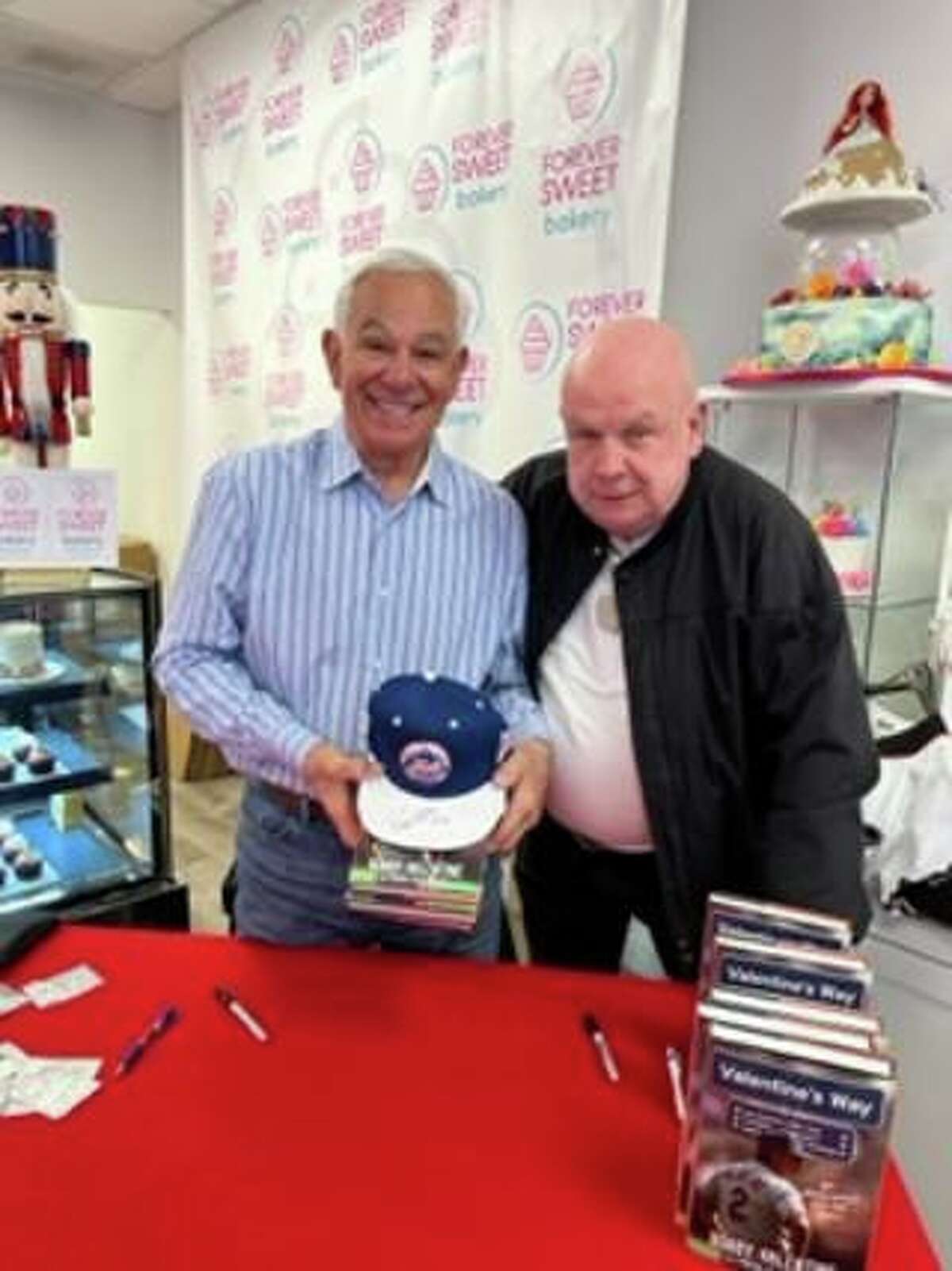 Former Major League Baseball manager Bobby Valentine, of Stamford, with Norwalk resident Art Kean of Kean's Korner Mobil in New Canaan at the Forever Sweet Bakery in Norwalk. Valentine signed copies of his book, "Valentine's Way," at the shop on Dec. 18.
