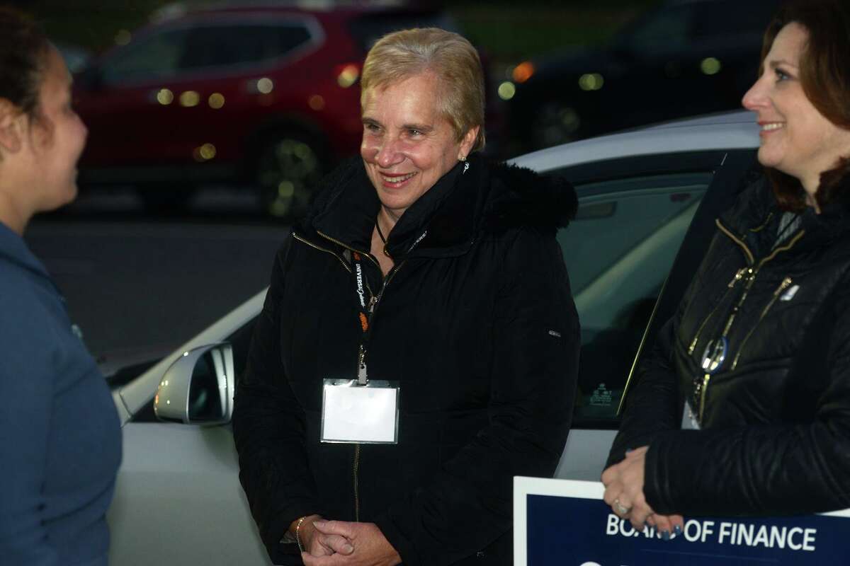 First Selectman Vicki Tesoro speaks with supporters outside Madison Middle School, in Trumbull, Conn. on Election Day, Nov. 2, 2021.