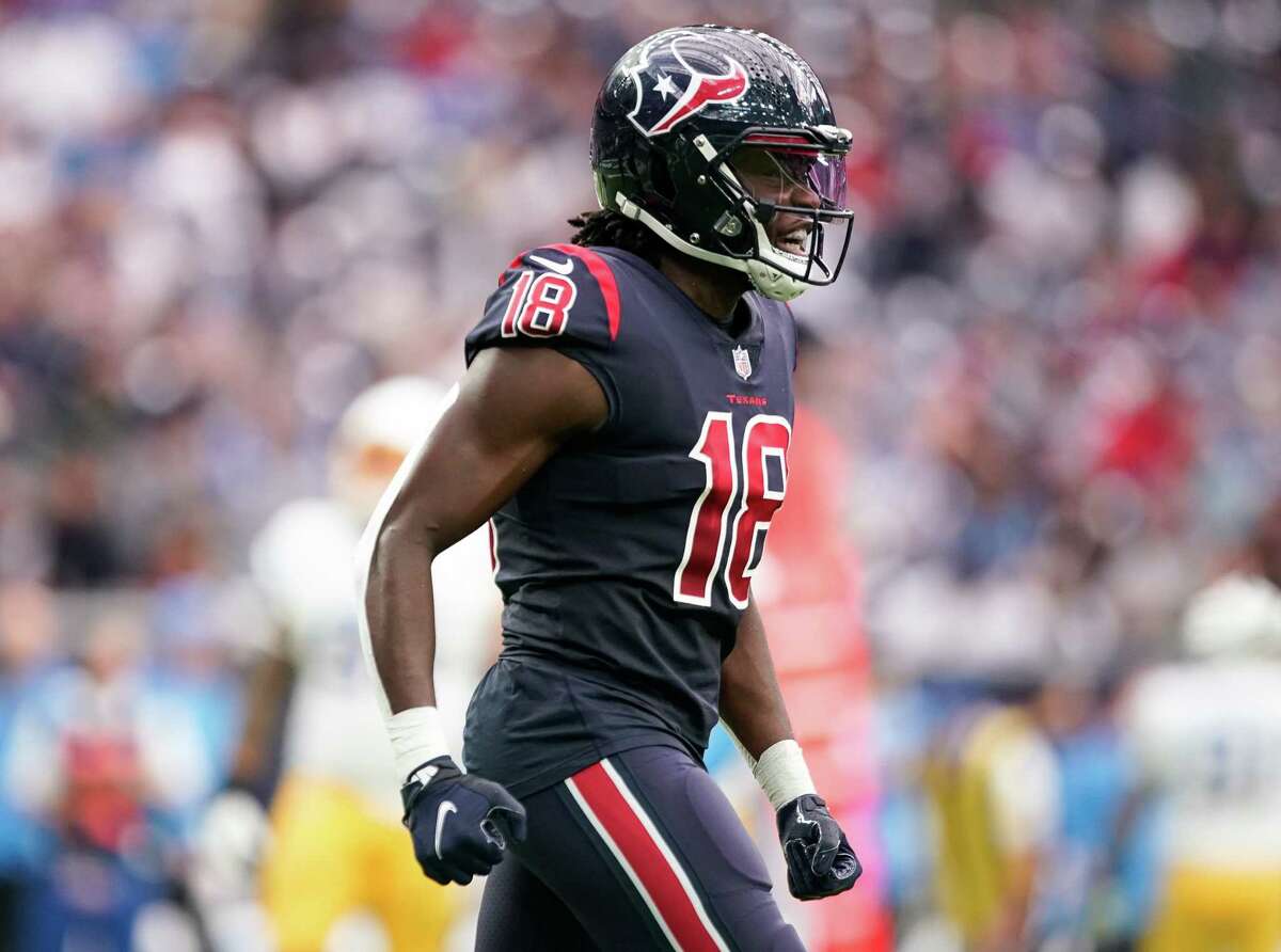 Houston Texans wide receiver Chris Conley (18) celebrates after scoring a 41-yard receiving touchdown against the Los Angeles Chargers during the second quarter of an NFL game at NRG Stadium on Sunday, Dec. 26, 2021, in Houston.