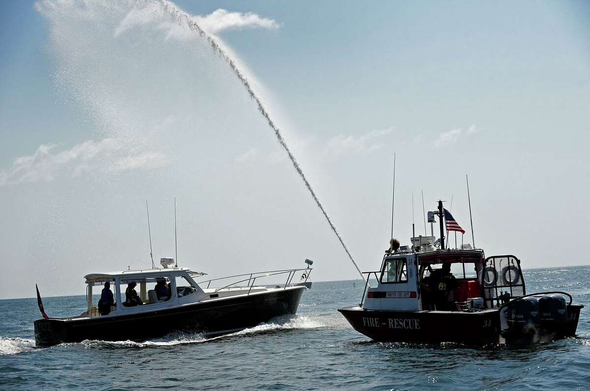 Campers from ROSCCO (Rogers School Community Center Organization) summer vacation program enjoy the water during the Noroton Yacht Club's 25th annual Boat/Camp Friday July 30, 2021, at the Yacht Club in Darien, Conn. Person-to-Person, Darien Boat Club, Darien Police Marine Unit, Noroton Fire Department, Norwalk Seaport Association, United States Coast Guard Auxiliary--Norwalk Flotilla 72 and Darien Sail and Power Squadron partner to provide a safe on-the-water experience for underserved children.