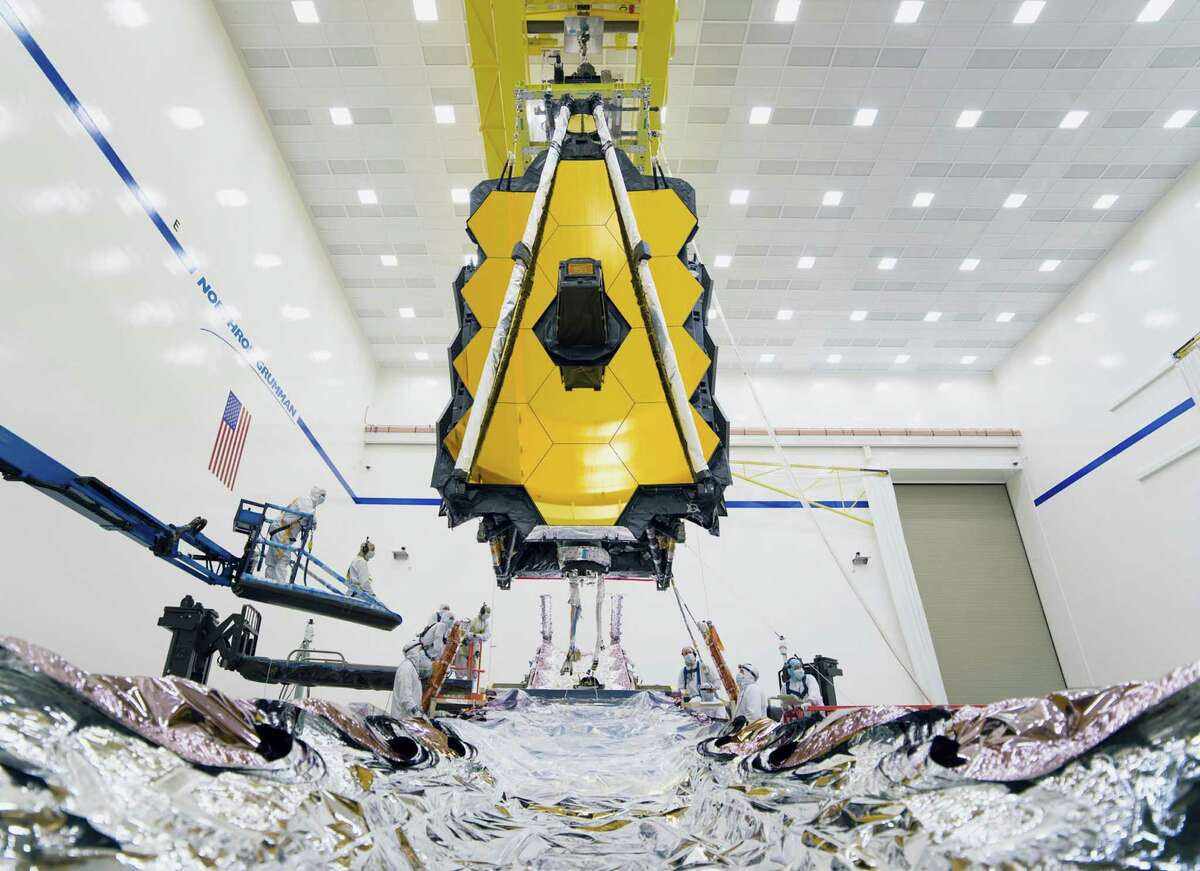 A photo provided by NASA shows assembly of the James Webb Space Telescope in a Northrop Grumman facility in Redondo Beach, Calif., in 2019. The Webb telescope is the biggest observatory built for launch into space. (Chris Gunn/NASA via The New York Times) — EDITORIAL USE ONLY —