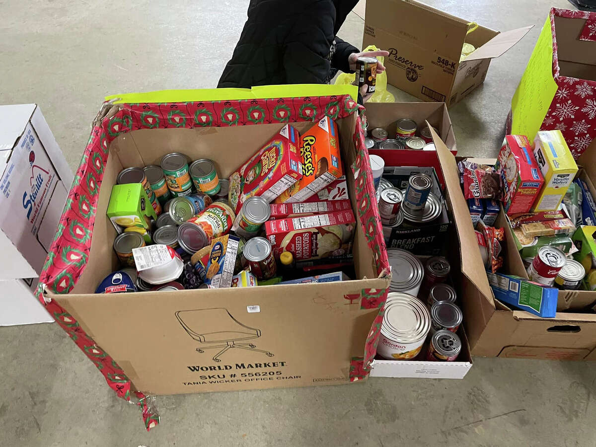 Members of the Cub Scouts Pack 174 Reed City were busy this holiday season. This year, the Scouting for Food program collected 3.5 tons of food for Project Starburst. Scouts and other volunteers worked hard to deliver and unload all of the goods.