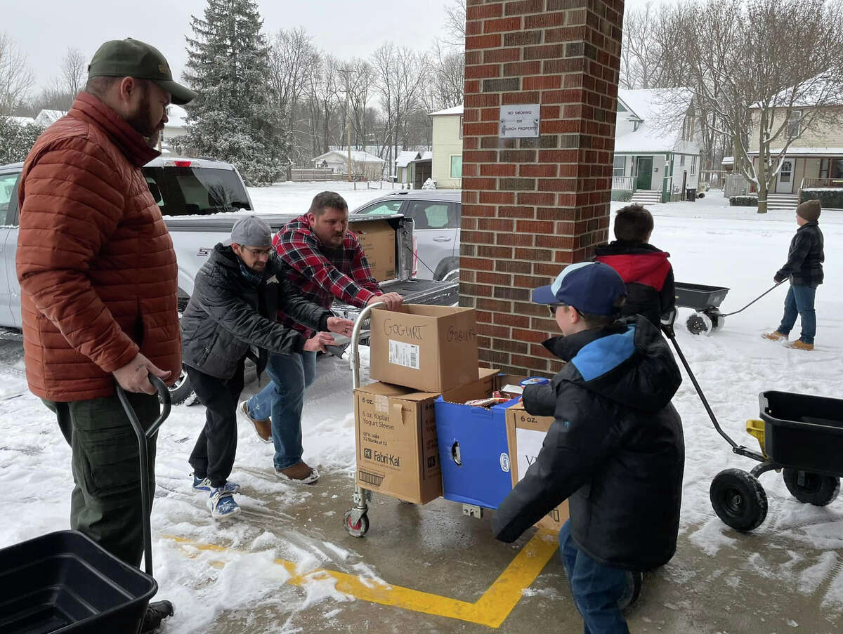 Members of the Cub Scouts Pack 174 Reed City were busy this holiday season. This year, the Scouting for Food program collected 3.5 tons of food for Project Starburst. Scouts and other volunteers worked hard to deliver and unload all of the goods.