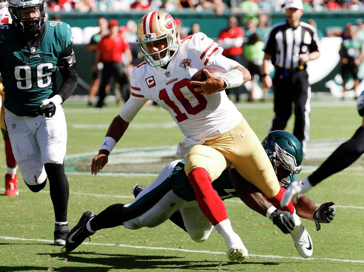 PHILADELPHIA, PENNSYLVANIA - SEPTEMBER 19: Quarterback Jimmy Garoppolo #10 of the San Francisco 49ers runs the ball in the fourth quarter in the game against the Philadelphia Eagles at Lincoln Financial Field on September 19, 2021 in Philadelphia, Pennsylvania. (Photo by Tim Nwachukwu/Getty Images)