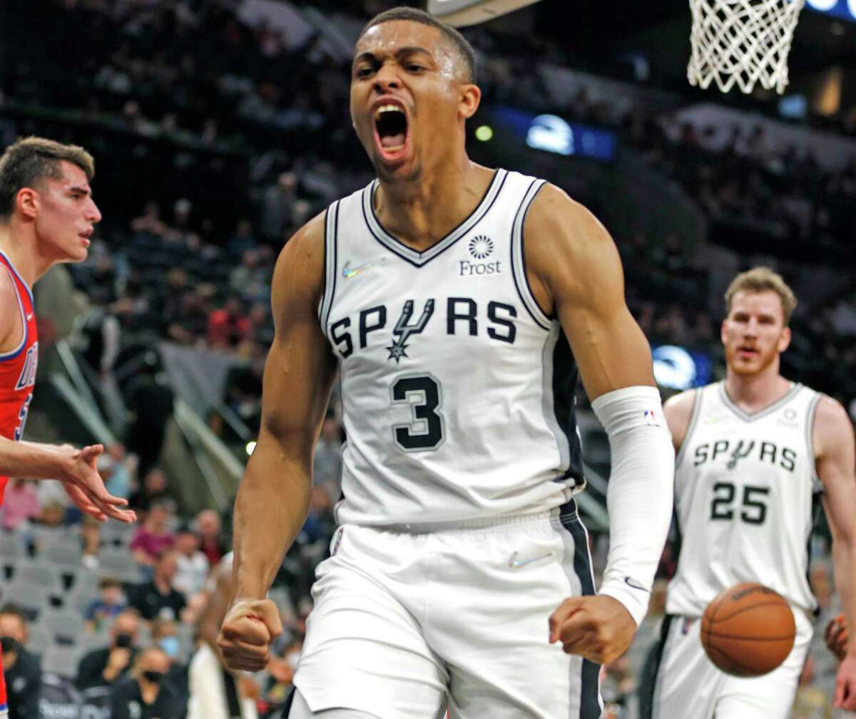 The Spurs’ Keldon Johnson reacts after a dunk in first half against the Pistons on Sunday, Dec. 26, 2021, at the AT&T Center.