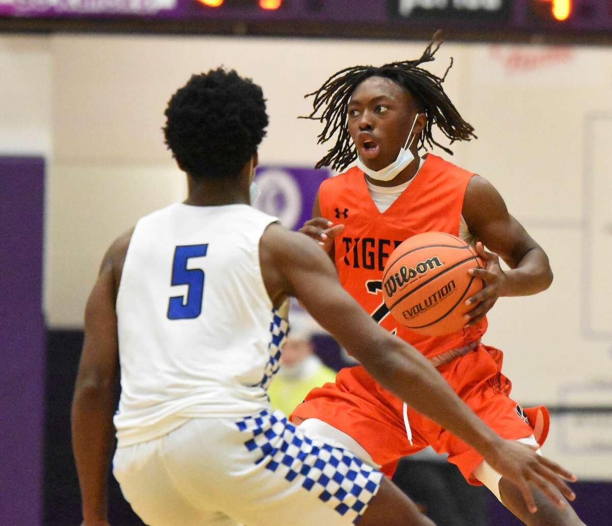 Edwardsville's Malik Allen races the ball up the court during the fourth quarter against Decatur MacArthur in Collinsville.