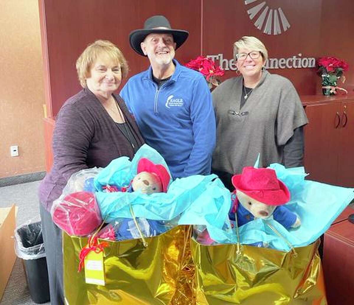 New Haven Middlesex Association of Realtors Sponsor Ron Rivard of Eagle Home Inspections delivers gifts for the children at The Connection in Middletown.