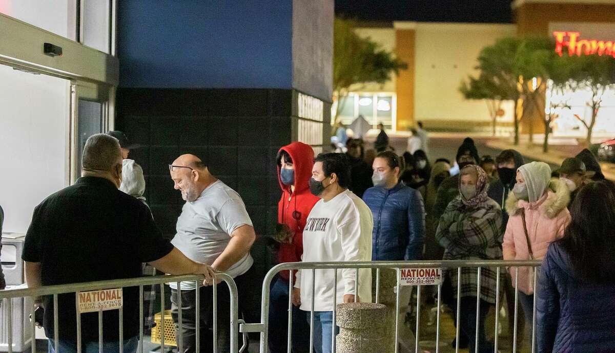 Shoppers walk into Best Buy as the store opens at 5 A.M., Friday, Nov. 26, 2021, during Black Friday.