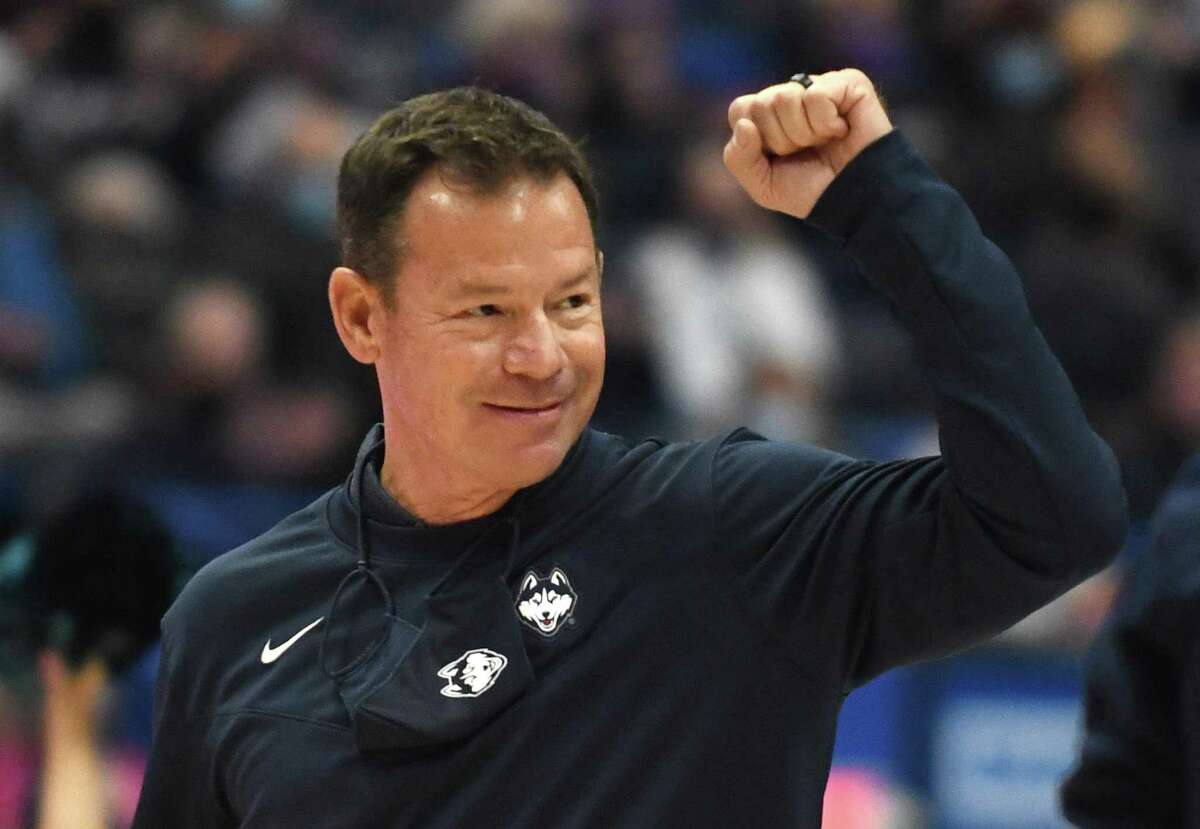 New UConn football coach Jim Mora Jr. speaks to the audience during UConn's season-opening 95-80 win over Arkansas in the NCAA women's basketball game at the XL Center in Hartford, Conn. Sunday, Nov. 14, 2021.