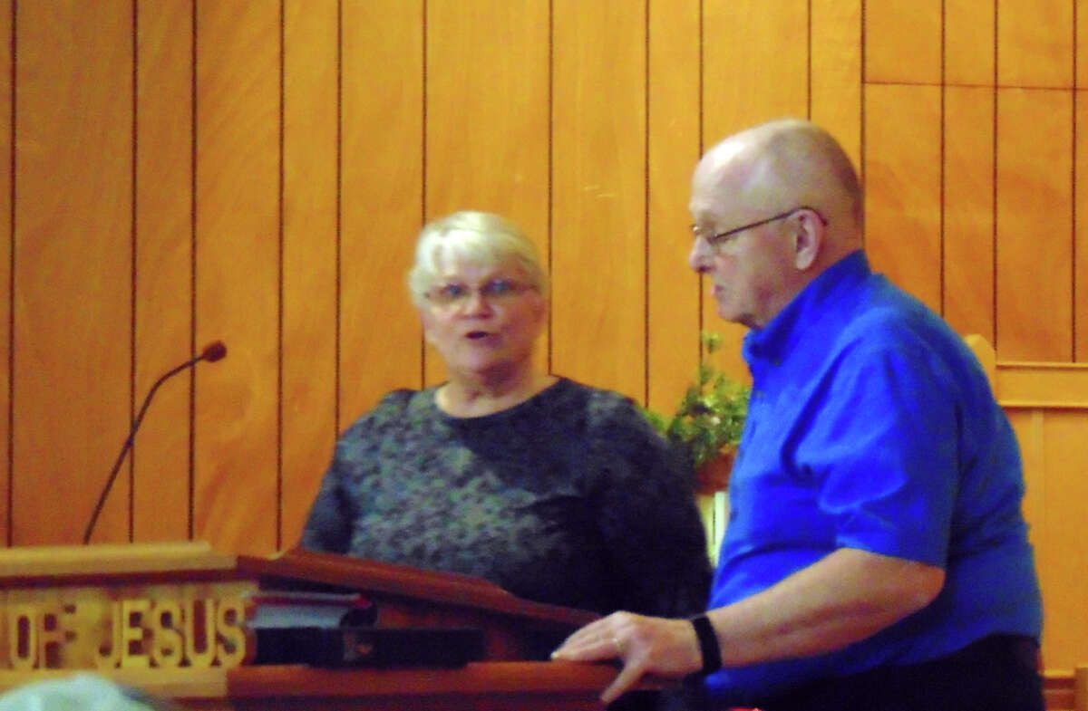 Pastor Lyle Ball (right) and his wife Jan (left), sing "Mary did you Know." 