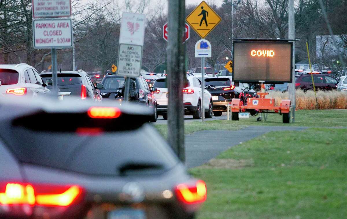 Hundreds of area residents came to Cove Island Park to get tested for COVID ahead of the holidays in Stamford, Conn., on Tuesday December 21, 2021. Sema4 was running the COVID test clinic at Stamford High School's parking lot, but traffic congestion forced the site to move to Cove Island Park.