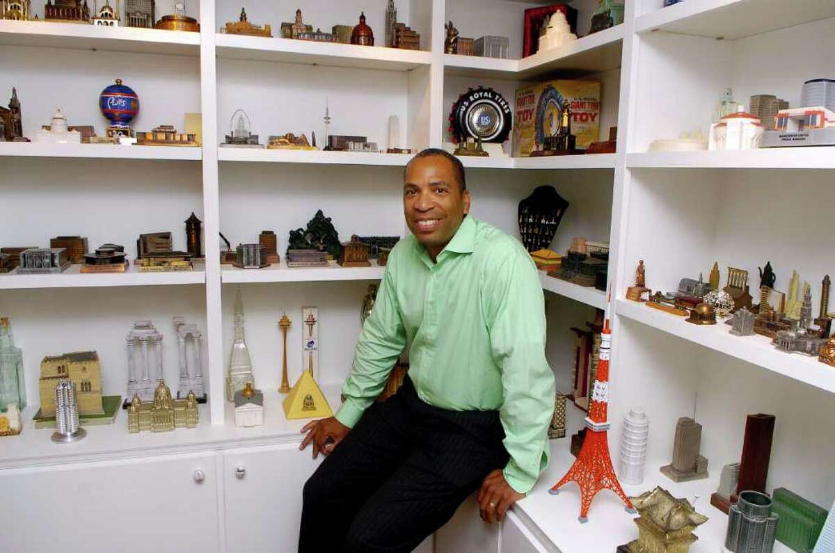 Darron Copeland is an employee of GE Capital who loves to collect miniatures. He is pictured on Thursday September 23, 2010 in a room he designed in his Stamford, Conn. to hold some of his miniature buildings.
