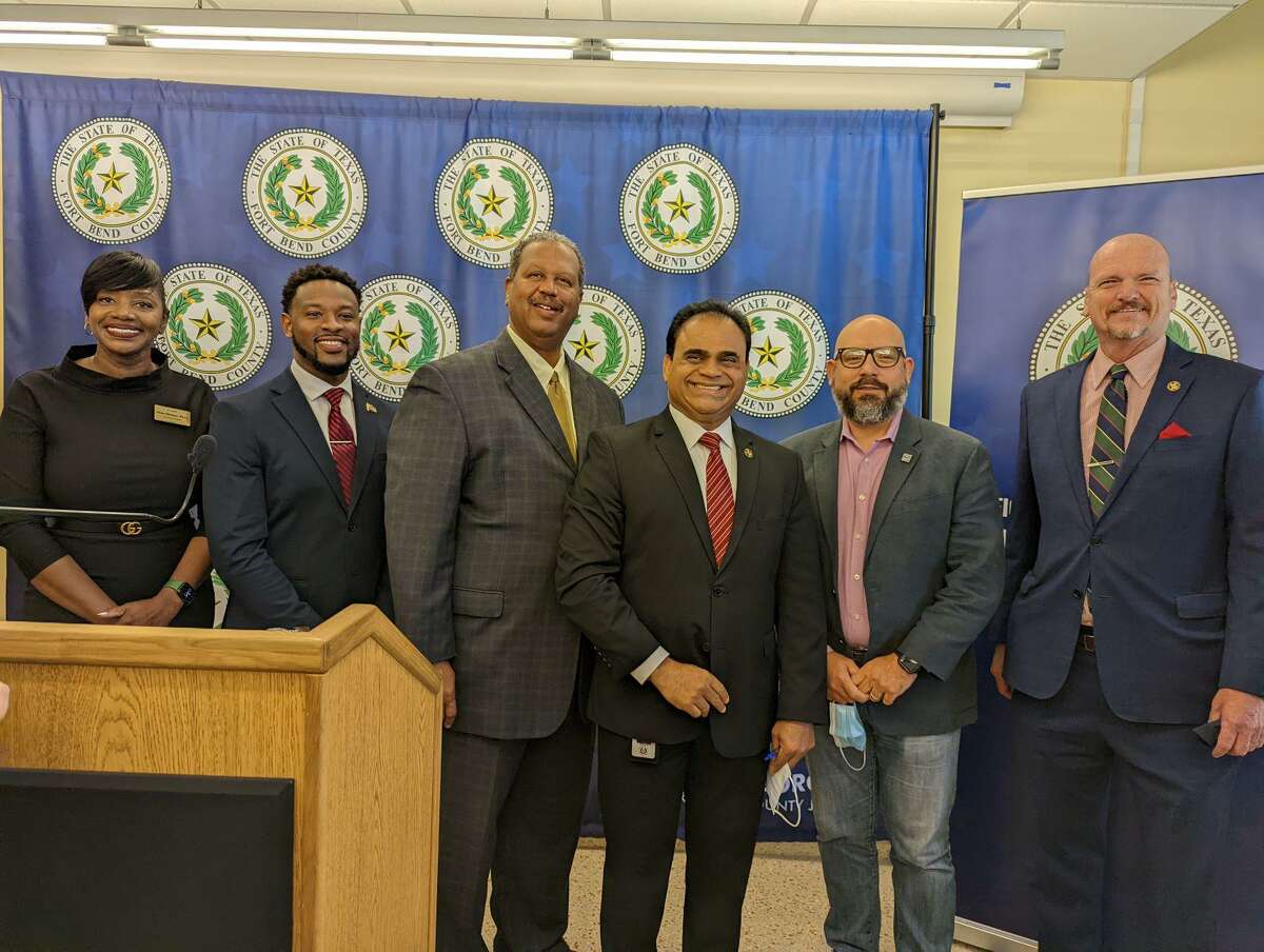 From left are Dr. Ilene Harper, executive director of the Family Life and Community Resource Center; Curtis Bowens, Fort Bend County Auditor’s Office; Grady Prestage, Fort Bend County Commissioners Court Precinct 2; KP George; Brandon Baca, CEO of Attack Poverty; Ken Demerchant, Fort Bend County Commissioners Court Precinct 4.
