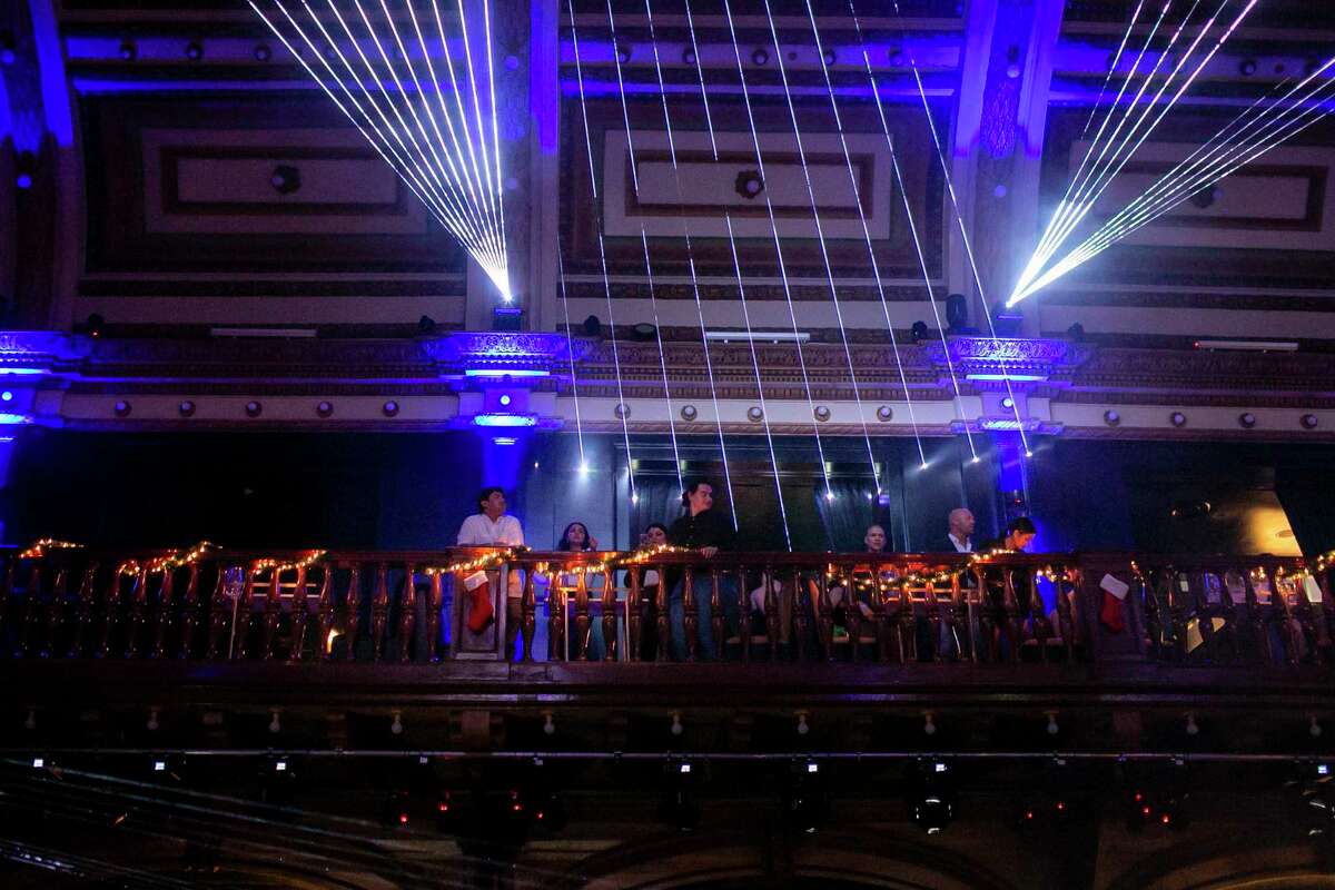 Patrons watch the dance floor from the se cond floor balcony at the Espee in San Antonio, Texas, on Dec. 18, 2021.