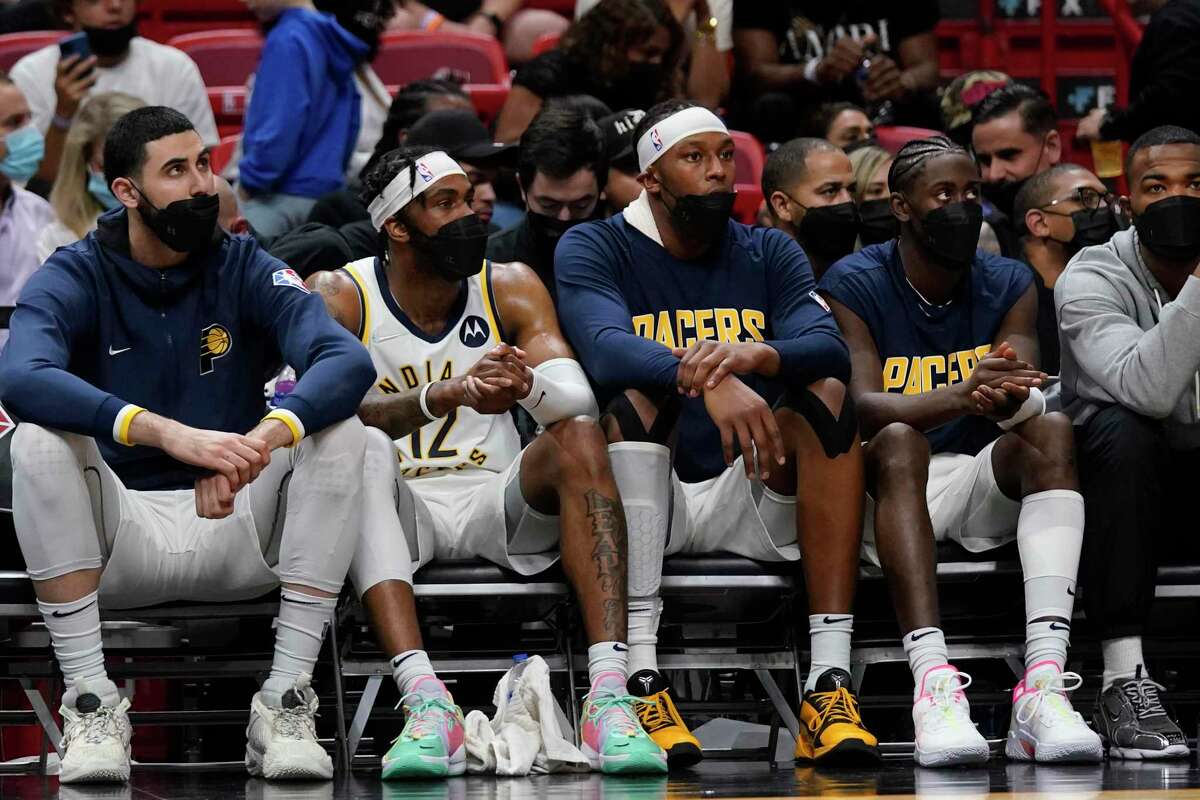 Indiana Pacers players wear masks to prevent the spread of COVID-19 as they sit on the bench during the first half against Miami last week.