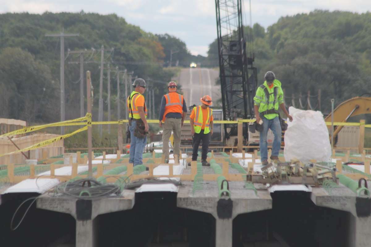 In this file photo, work is done on the center span of the M-55 bridge project in Manistee Township in September.
