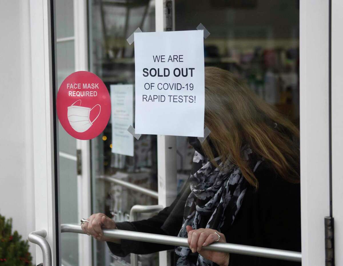 A sign states that COVID-19 rapid tests are sold out at Grieb's Pharmacy on Tuesday.