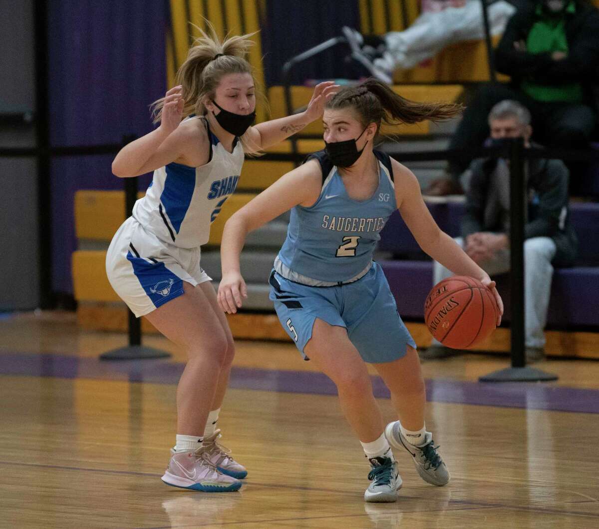 Shaker’s Cece Boisvert, left, guards Saugerties’ Natalie Tucker during a basketball game on Tuesday, Dec. 28, 2021 in Amsterdam, N.Y.