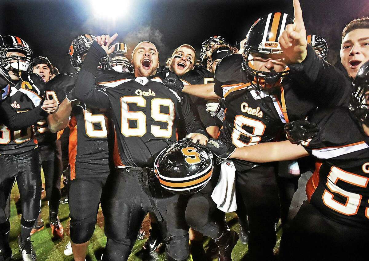 Shelton celebrates their 56-7 win over Derby during the Thanksgiving Day game in 2014.