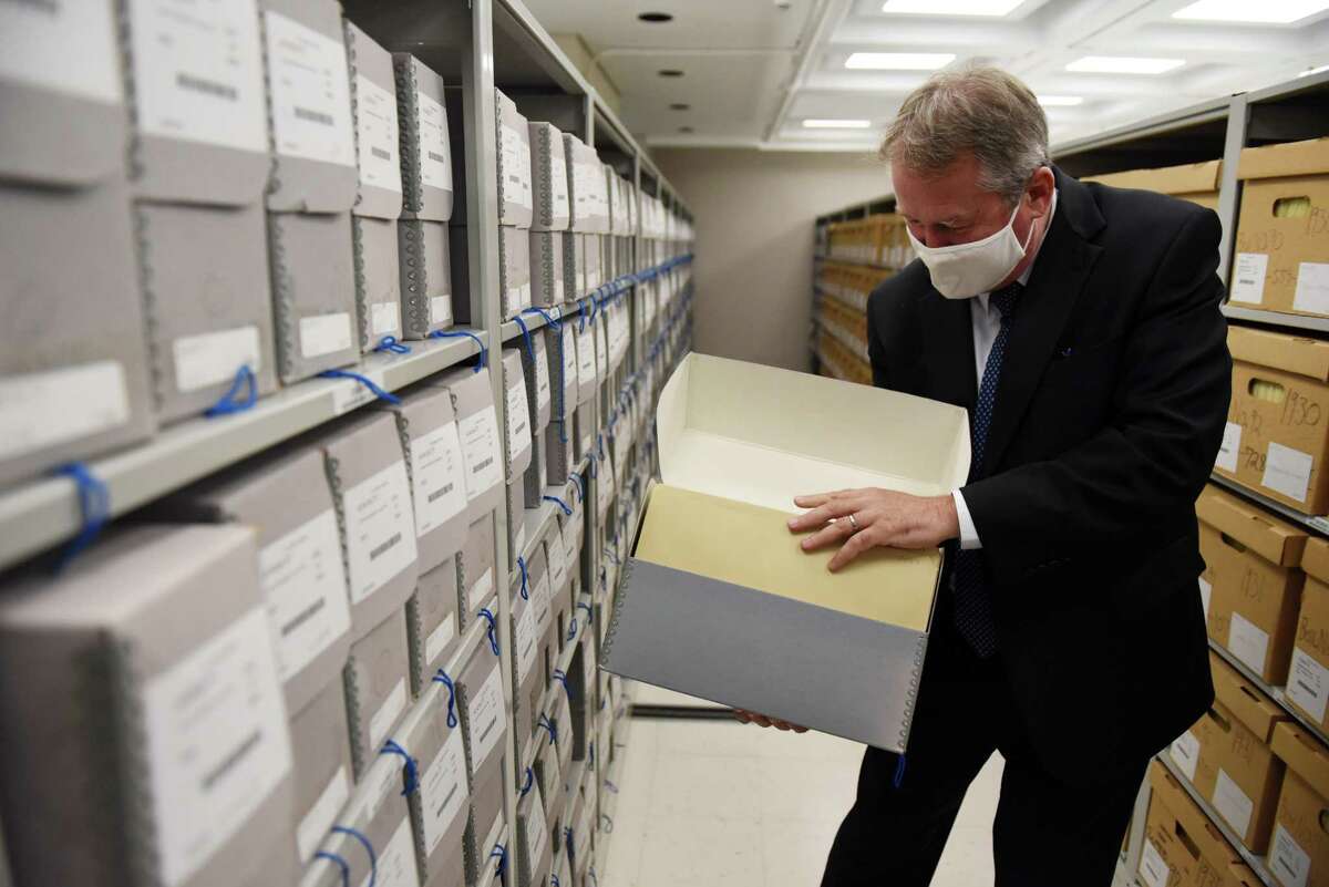 Tom Ruller, Assistant Commissioner and State Archivist at New York State Education Department, looks through the state's collection of New York State Motion Picture Commission movie approval applications on Tuesday, Oct. 5, 2021, at the NYS Archives in Albany, N.Y. Films were submitted to the state's review board for approval from 1921 to 1965. They faced potential censorship that could involve cutting scenes, or outright rejection in some cases. The archive contains case files which often include a script.