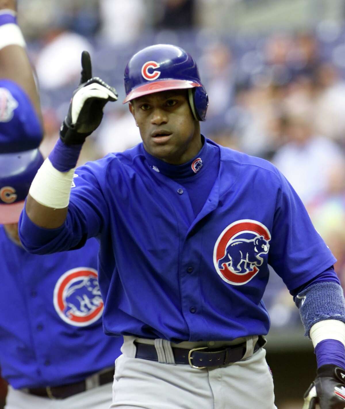 Chicago Cubs' Sammy Sosa celebrates after hitting a two-run home run off Cincinnati Reds pitcher Chris Rietsma in the first inning, Wednesday, May 30, 2001, in Cincinnati. (AP Photo/Al Behrman)