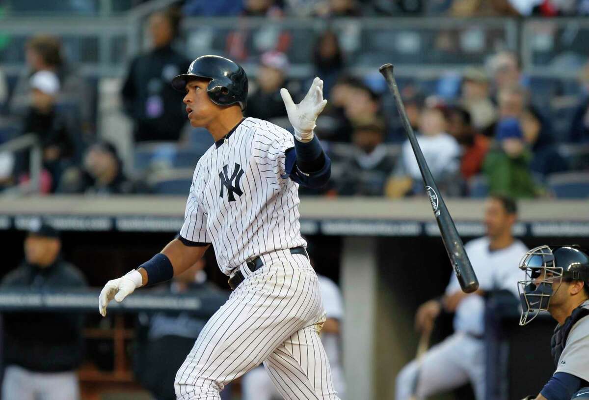 The New York Yankees Alex Rodriguez tosses his bat as he hits a solo home run in the 6th inning. The New York Yankees beat the Detroit Tigers, 10-6, at Yankee Stadium. BRONX, NY 4/2/11 (Tim Farrell/The Star-Ledger)