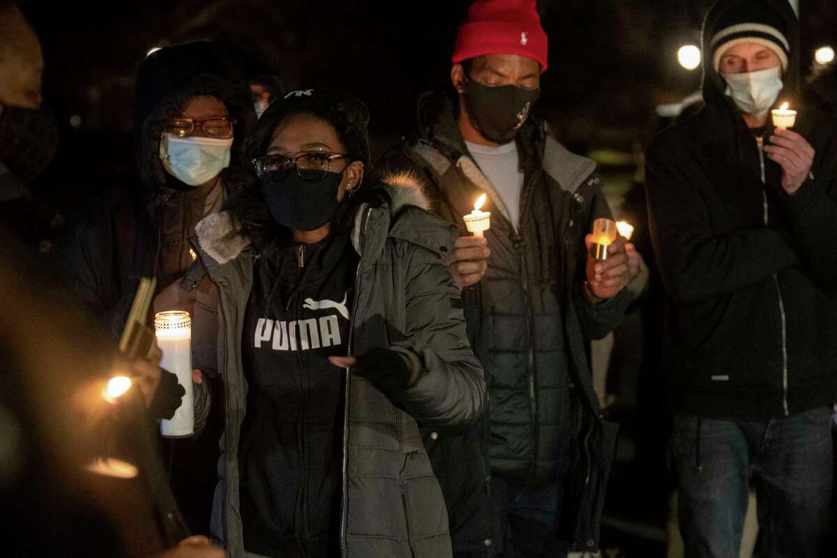 Family and friends take turns to share a memory as they hold a candlelight vigil at Tawasentha Park for Kentish Bennett, aka Kayla Stennet, on Tuesday, Dec. 28, 2021 in Guilderland, N.Y.