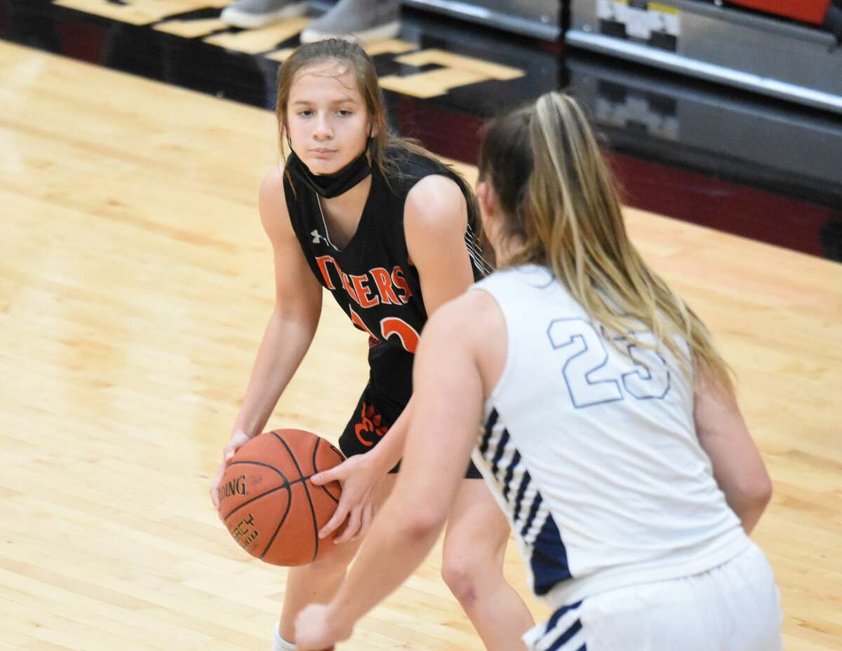 Edwardsville's Ellie Neath runs the offense during the second half against Marquette on Tuesday in the fifth-place game of the Visitation Christmas Tournament.