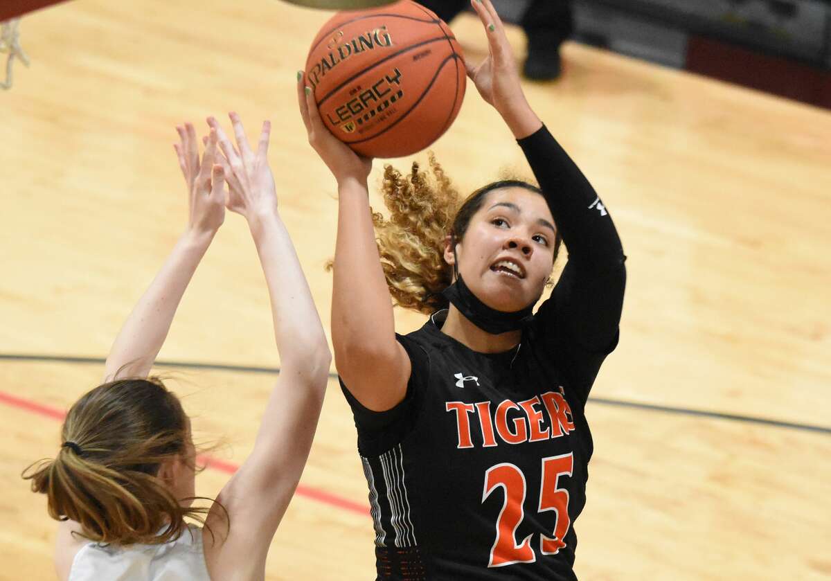 Edwardsville's Sydney Harris hits a shot near the basket during the second half against Marquette on Tuesday in the fifth-place game of the Visitation Christmas Tournament.