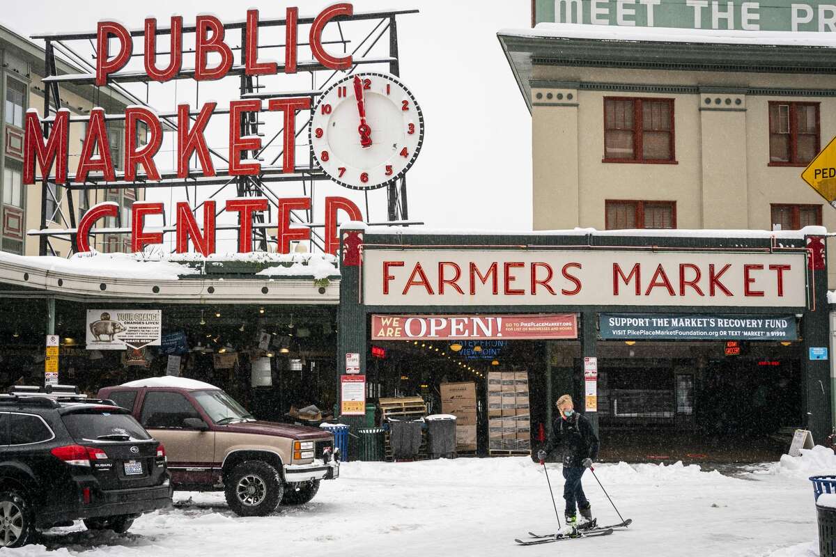 Harrison Walsh skis by Pike Place Market on February 13, 2021 in Seattle, Washington. 