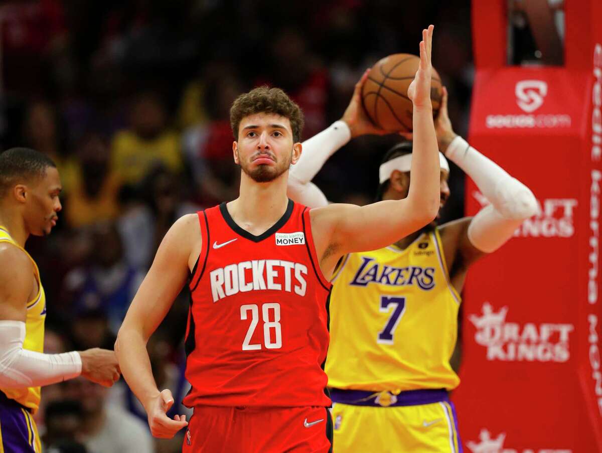 Houston Rockets center Alperen Sengun (28) reacts after making a shot and being fouled over Los Angeles Lakers forward Carmelo Anthony (7) during the second half of an NBA game between the Houston Rockets and Los Angeles Lakers on Tuesday, Dec. 28, 2021, at the Toyota Center in Houston.