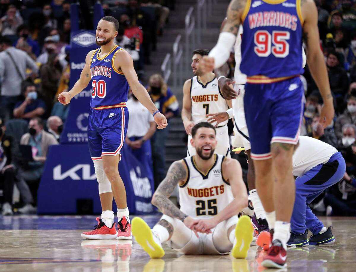 Golden State Warriors' Stephen Curry reacts after Juan Toscano-Anderson was called for a foul on Denver Nuggets' Austin Rivers in 3rd quarter during NBA game at Chase Center in San Francisco, Calif., on Tuesday, December 28, 2021.