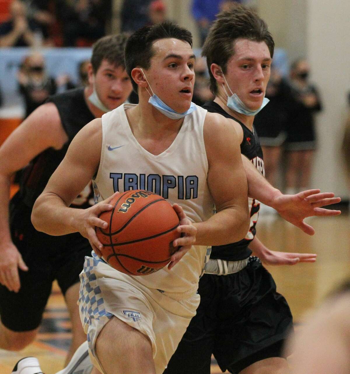 Action from the Triopia boys' basketball team's win over Greenfield-Northwestern in the quarterfinals of the Waverly Holiday Tournament on Tuesday