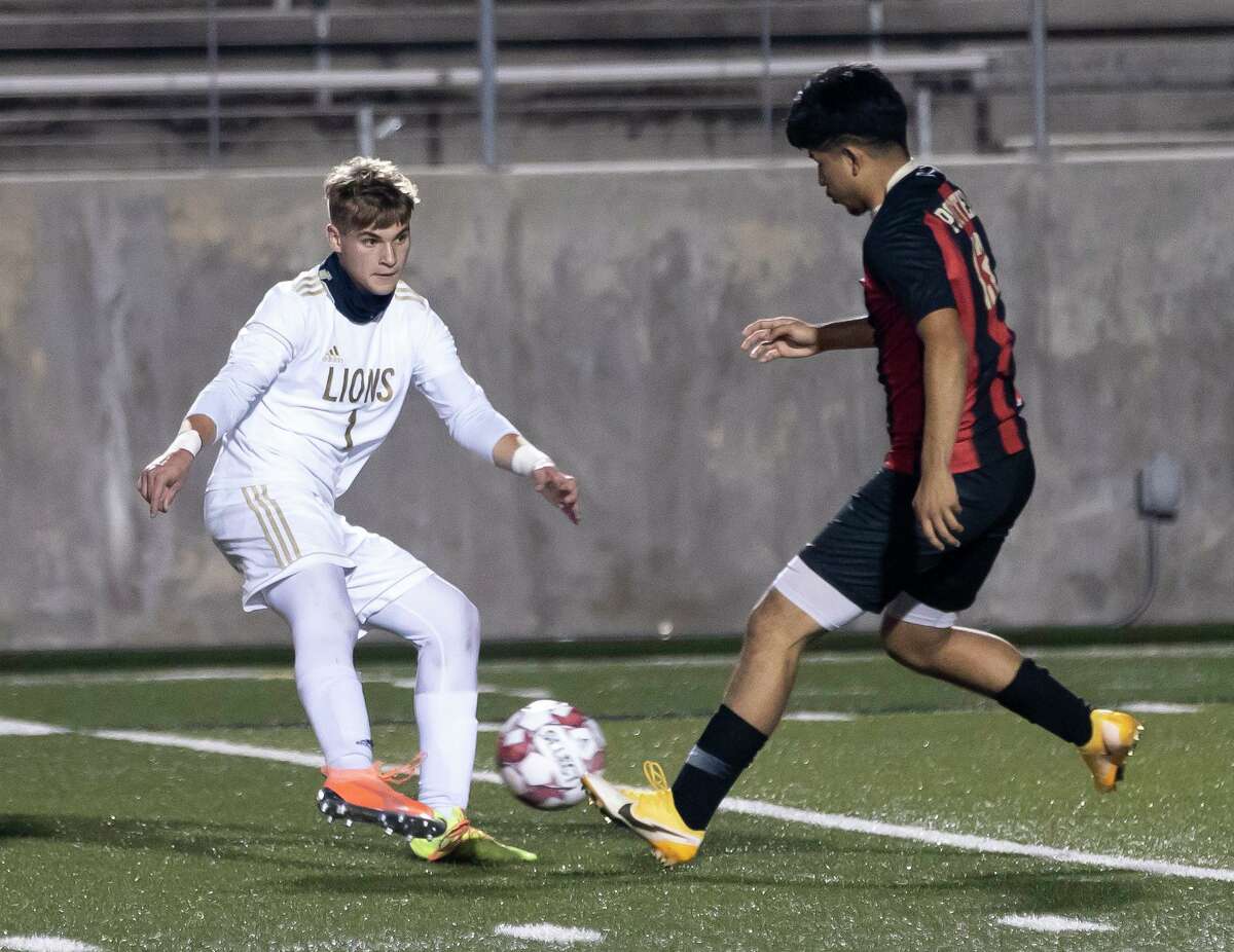 Lake Creek Justin Mayes (1) intercepts Porter Jose Acosta (13) while Acosta controls the ball during the first half of a District 20-5A boys soccer at Randall Reed Stadium, Friday, March 5, 2021, in New Caney.