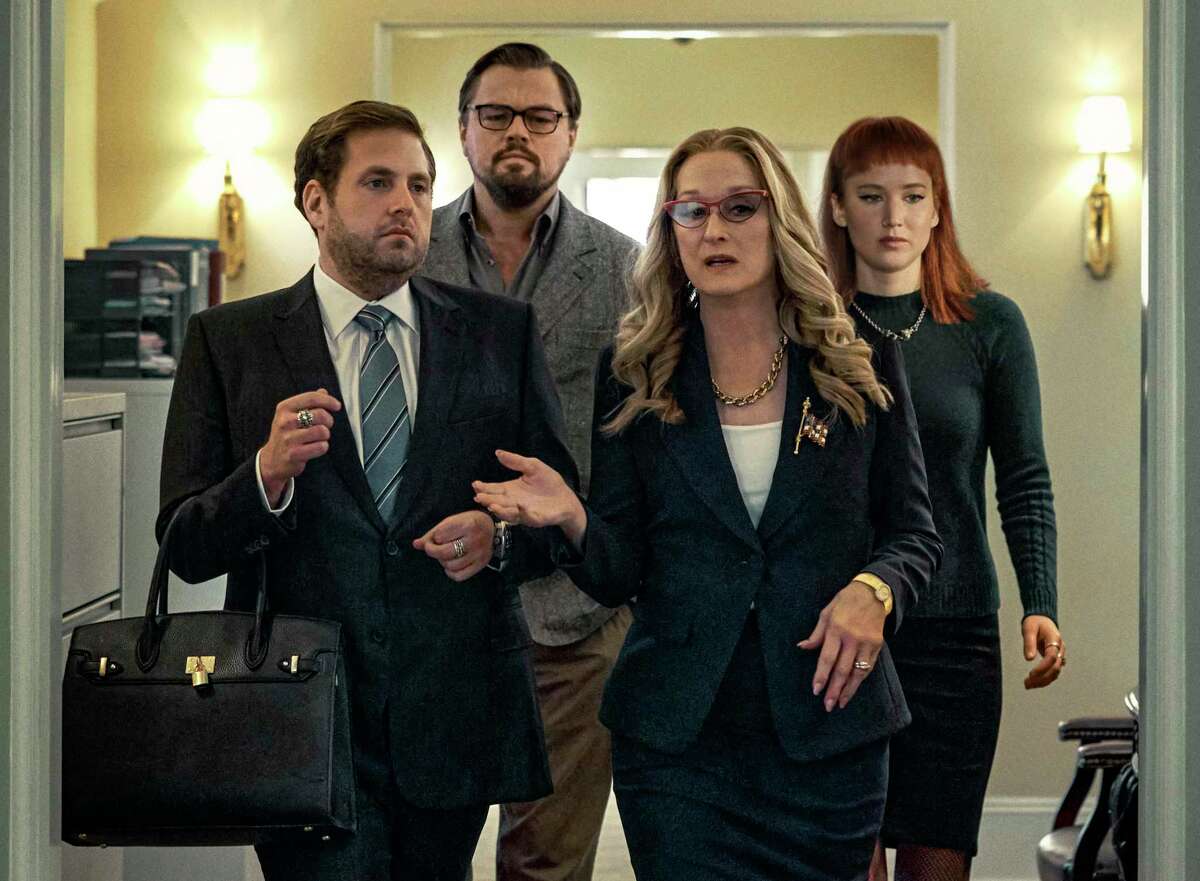 This image released by Netflix shows Jonah Hill, from left, Leonardo DiCaprio, Meryl Streep and Jennifer Lawrence in “Don't Look Up.” Danny Minton picked “Don’t Look Up” as his favorite film from 2021.