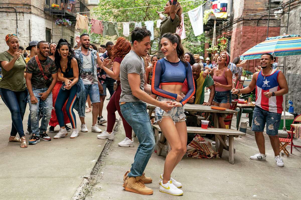 Anthony Ramos (left, foreground) and Melissa Barrera in the musical “In the Heights.”