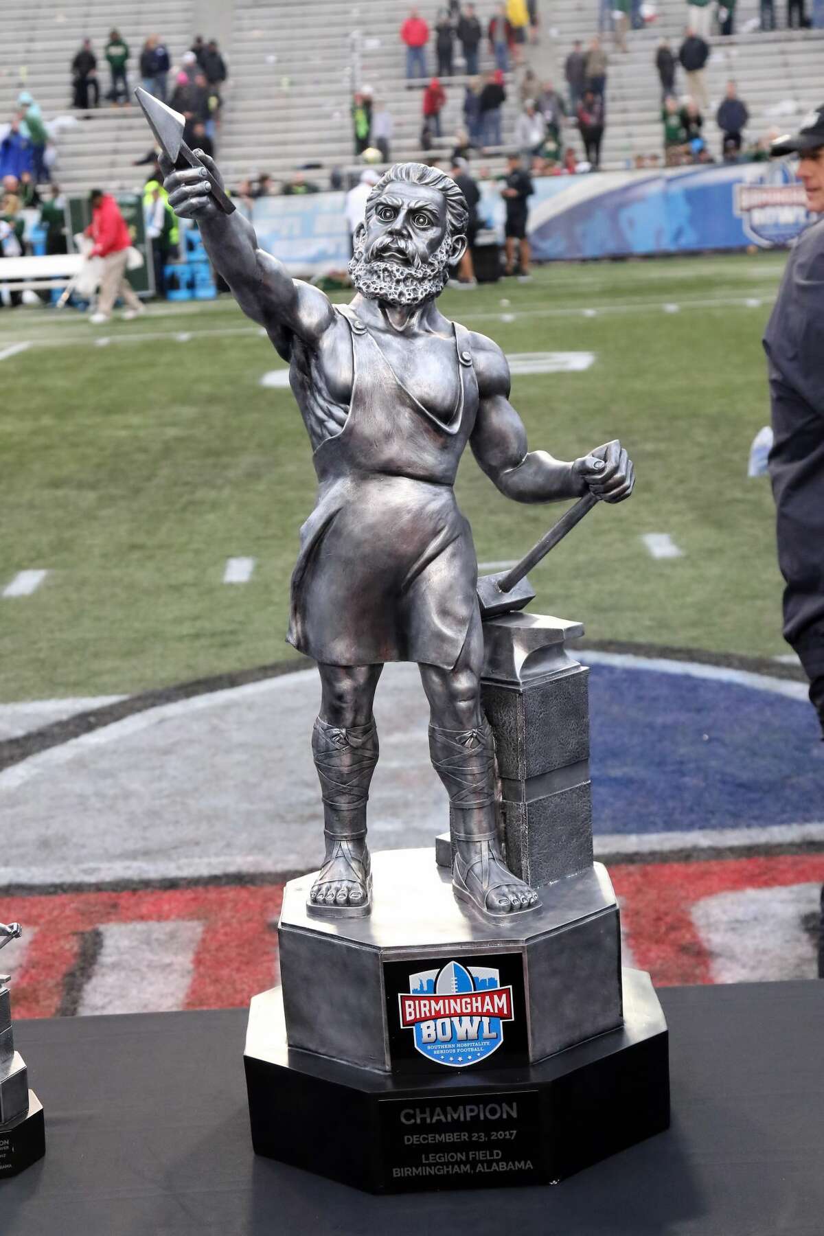 The Birmingham Bowl trophy that the University of Houston brought home Tuesday is of Vulcan, the Roman god of fire and forge. A larger statue of the god is located in Birmingham as a tribute to the city's iron industry.