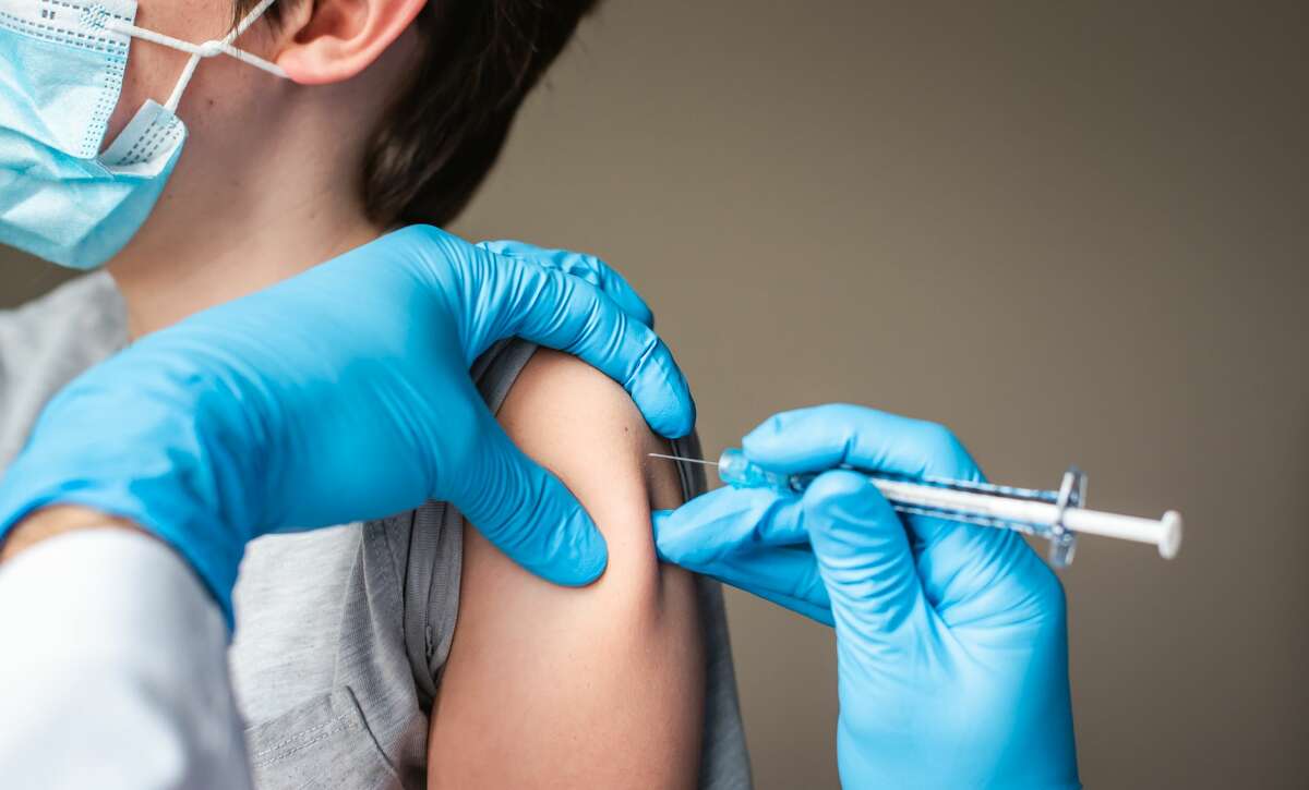 A fourth grader gets the COVID-19 vaccine. 