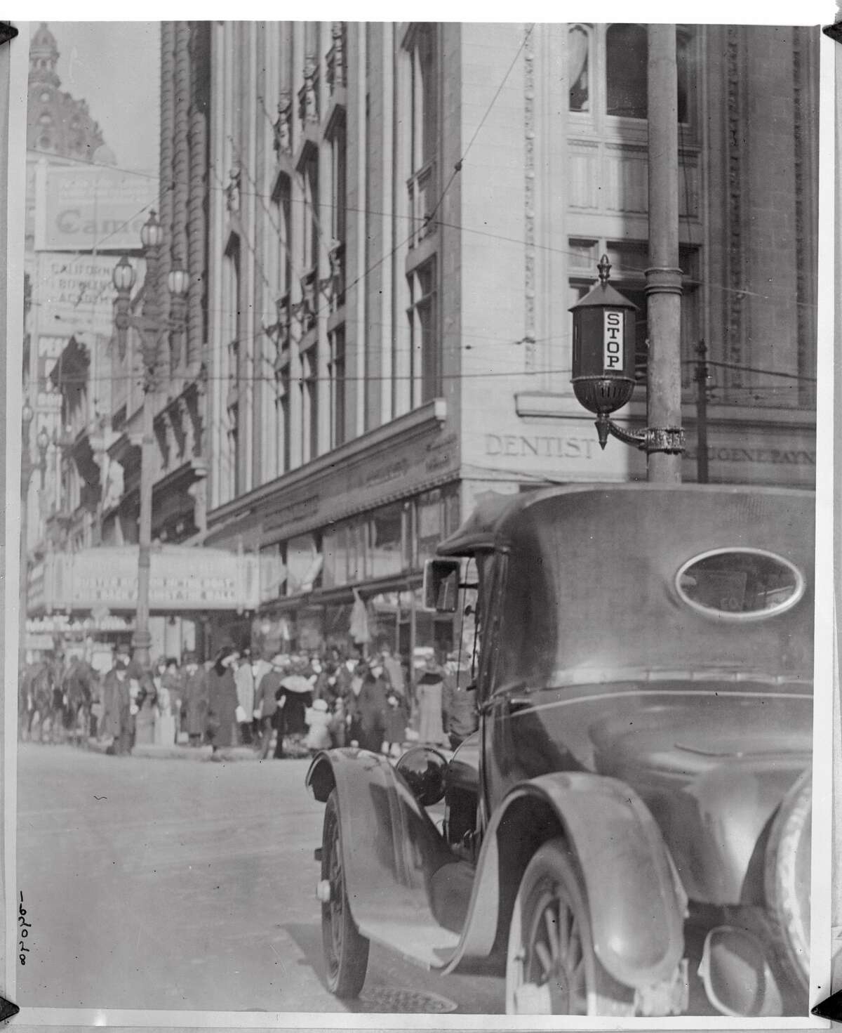 A car stops at a brand new stoplight in San Francisco's downtown. 