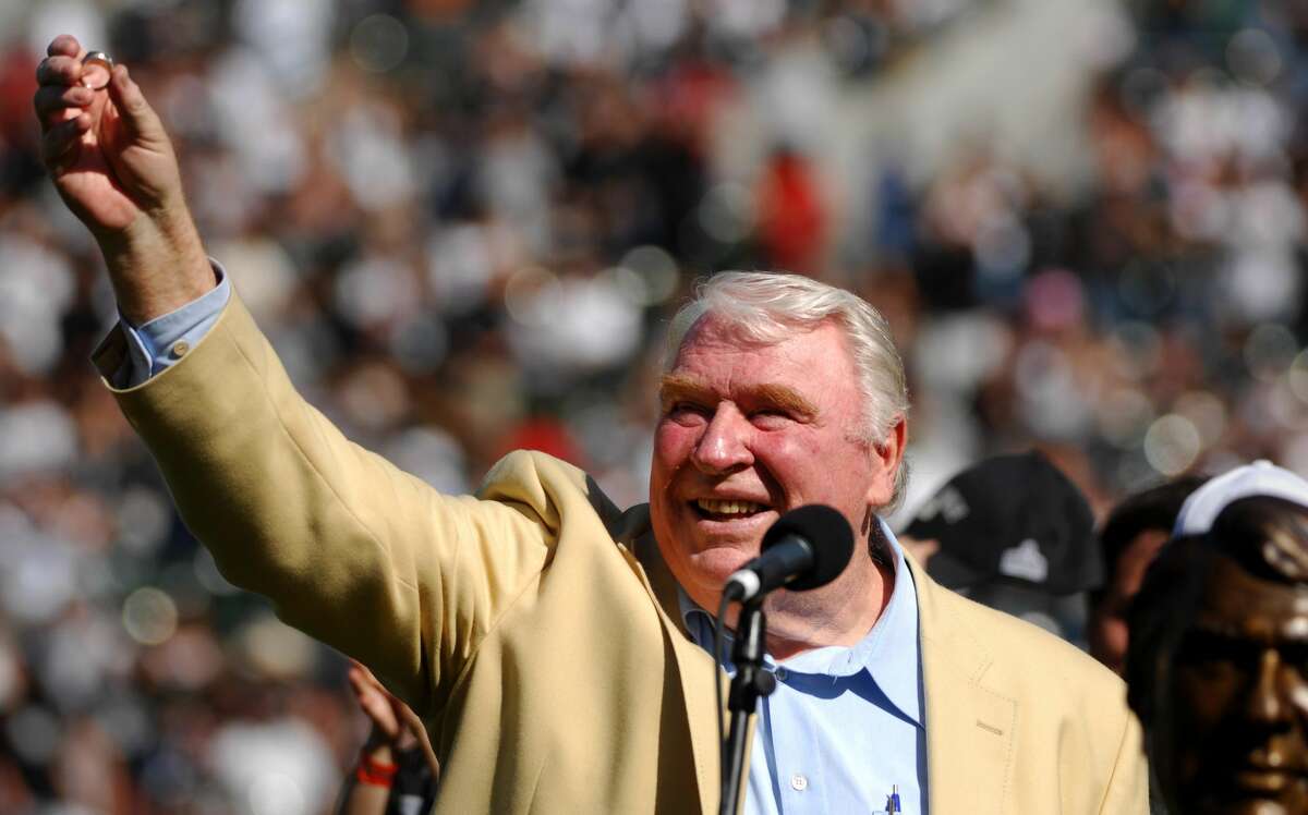 Former Oakland Raiders coach John Madden displays his Pro Football Hall of Fame ring to the crowd during a pregame ceremony to recognize his induction at McAfee Coliseum in Oakland, Calf. on Sunday, October 22, 2006.