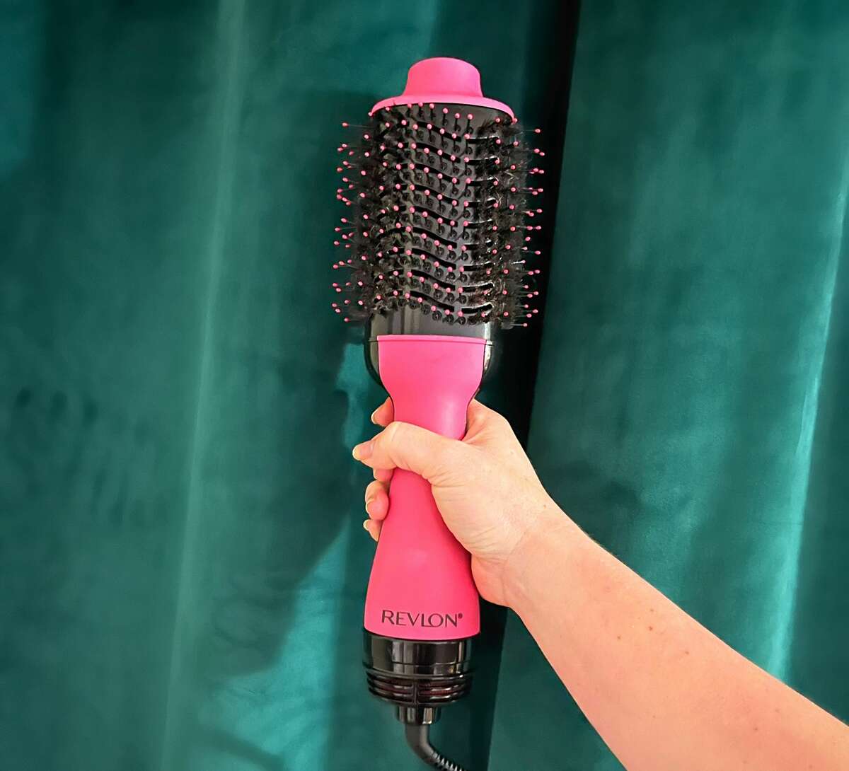 The Revlon One-Step Hair Dryer & Volumizer with its non-detachable round brush head.Â 