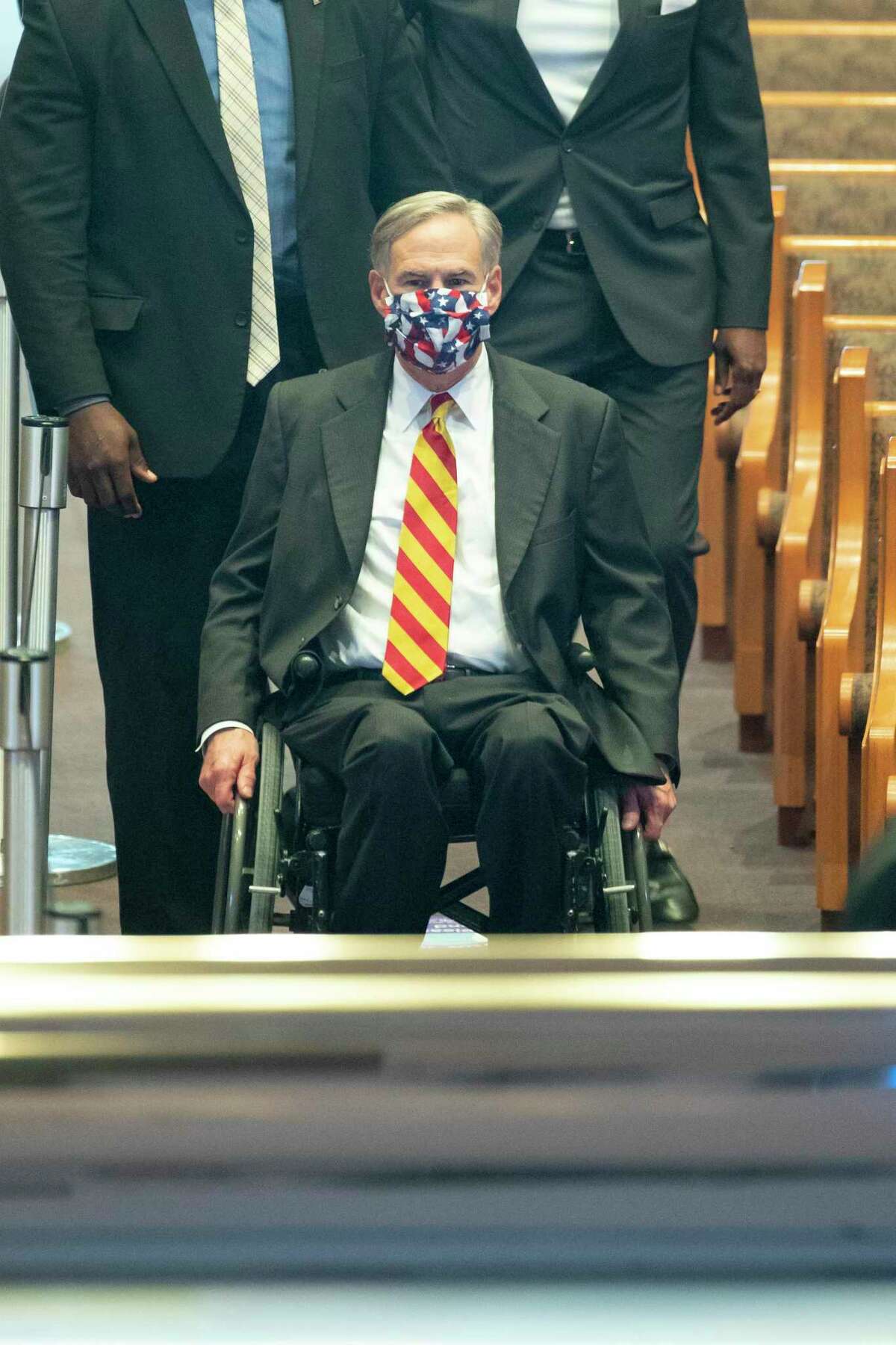 Texas Governor Greg Abbott visits the casket during a public visitation for George Floyd Monday, June 8, 2020, at The Fountain of Praise church in Houston. Floyd was killed after being restrained by Minneapolis Police officers on May 25, 2020.