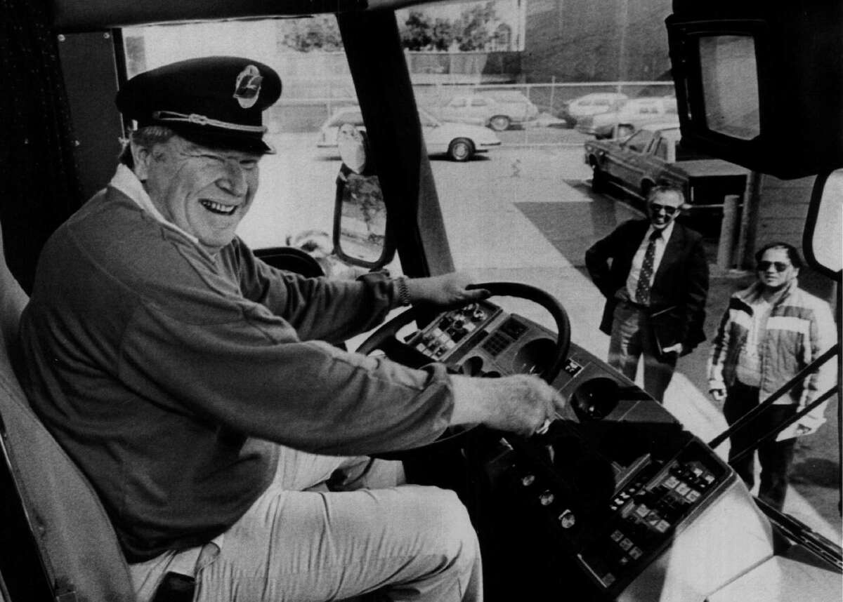 John Madden of the Oakland Raiders smiles while sitting on his bus circa 1970s.