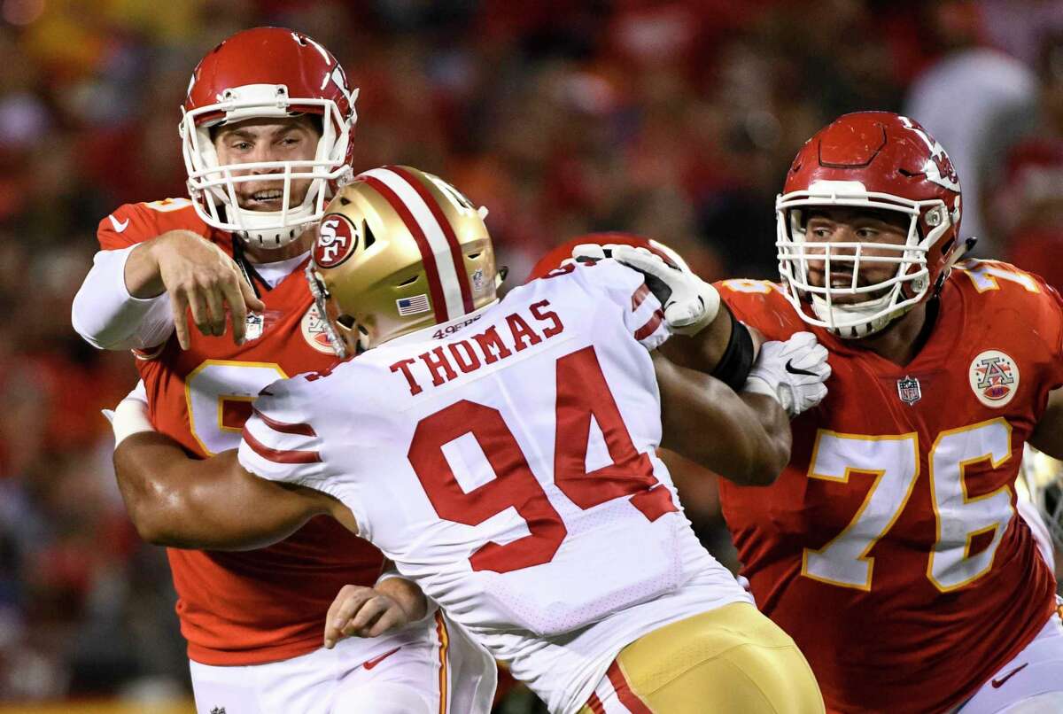 Kansas City Chiefs quarterback Tyler Bray (9) is pressured by San Francisco 49ers defensive lineman Solomon Thomas (94) during the first half of an NFL preseason football game in Kansas City, Mo., Friday, August 11, 2017. (AP Photo/Reed Hoffmann)