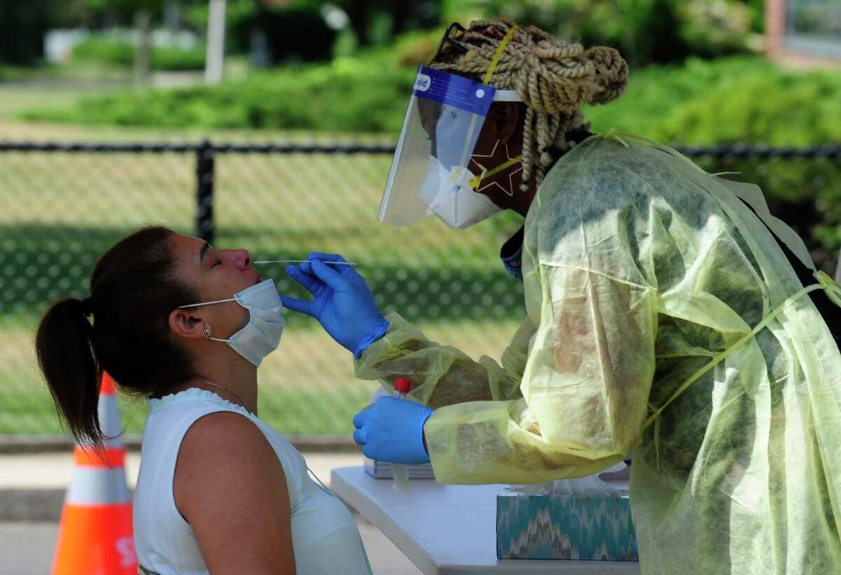Alexandra Velez of Stamford gets tested by Dr. Kisha Mitchell Richards during a free COVID 19 testing clinic in Stamford, Connecticut on June 20, 2020. 