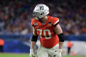 Virginia offensive tackle Bobby Haskins (70) in action during the second half of the Orange Bowl NCAA college football game against Florida, Monday, Dec. 30, 2019, in Miami Gardens, Fla. (AP Photo/Lynne Sladky)
