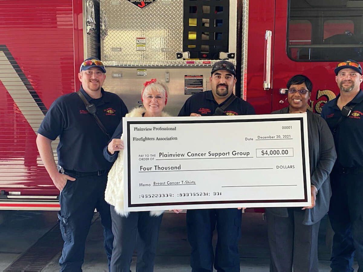 Pictured L-R: Firefighter David Warren; Andrea Ingram, Plainview Cancer Support Group member; firefighter Carlos Martinez, event coordinator; Sherry Wall, PCSG member; and firefighter Cameron Lunsford, equipment operator  